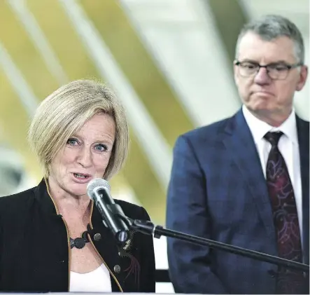  ?? ED KAISER ?? Premier Rachel Notley answers questions Thursday about the tuition review, which was a year late, as University of Alberta president David Turpin listens. The review drew more than 4,200 online survey responses.