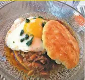  ??  ?? A surprising meat-eaters’ brunch special from the king of vegetarian chefs, David Sweeney: brisket, a biscuit, tomato jam, and a perfect fried egg. (Photo by Cliff Bostock)
