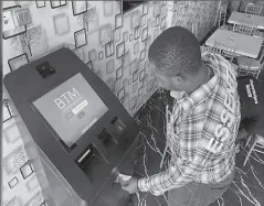  ?? LAGOS, NIGERIA
-REUTERS ?? A bitcoin user buys bitcoins with naira on Bitcoin Teller Machine in Lagos, Nigeria.