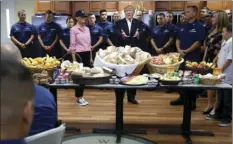  ?? AP PHOTO/ALEX BRANDON ?? President Donald Trump, with first lady Melania Trump, speaks to members of the U.S. Coast Guard, at the Lake Worth Inlet Station, on Thanksgivi­ng on Thursday in Riviera Beach, Fla.