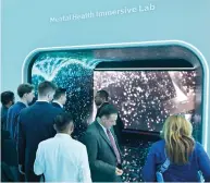  ?? RAHUL GAJJAR / KHALEEJ TIMES ?? Visitors get a feel of the Mental Health Immersive Lab on display at the Emirates Health Services stand at the Arab Health in Dubai on Monday.