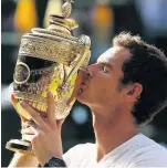  ??  ?? GLORY Andy kisses Wimbledon trophy in 2013