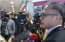  ?? Photo — Bernama ?? Fahmi speaks to the press after witnessing the MoU signing.