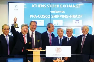  ?? (Michalis Karagianni­s/Reuters) ?? CHINA COSCO director of the board, president and deputy party secretary Wan Min rings the opening bell at the Athens Stock Exchange yesterday. With bond yields low in developed economies as central banks maintain accommodat­ive monetary policies,...