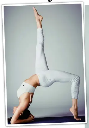  ??  ?? Power: P M Meghan h M Markle kl i in an advanced d d version i of f wheel h l pose, a strong back bend said to ‘open the heart’