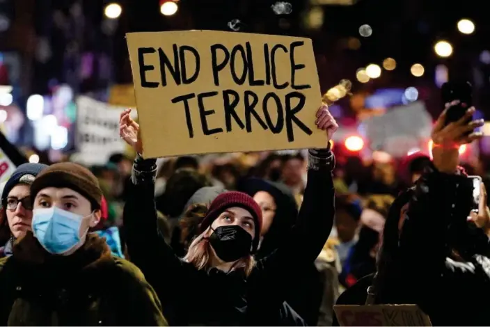  ?? Photograph: David Dee Delgado/Reuters ?? A person holds a sign during a protest following the 7 January 2023 police beating of Tyre Nichols, who died three days later.