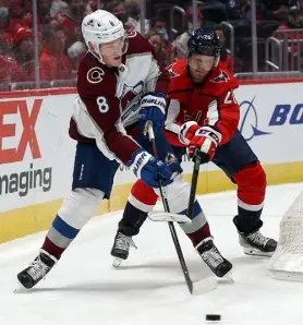  ?? Rob Carr, Getty Images ?? Colorado’s Cale Makar, left, battles with Lars Eller of the Capitals on Tuesday night in Washington.