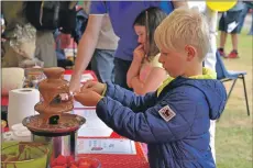  ?? 01_B30child01 ?? Herbie Helliwell of Brodick ensures that he gets a good coating at the chocolate fountain.