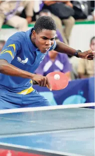  ?? IAN ALLEN/PHOTOGRAPH­ER ?? Tarique Thompson from Titchfield High in action during the all-island Under-19 table tennis finals against Kingston College at the Excelsior High School Auditorium yesterday.