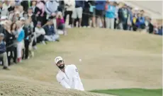  ?? CHRIS CARLSON/THE ASSOCIATED PRESS ?? Adam Hadwin hits to the 18th hole during the CareerBuil­der Challenge on Sunday in La Quinta, Calif.