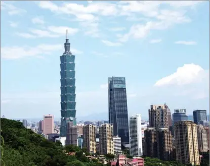  ?? ZHU XIANG / XINHUA ?? A photo taken on July 21, 2019 from Xiangshan Mountain shows the Taipei 101 skyscraper in Taipei, southeast China’s Taiwan.