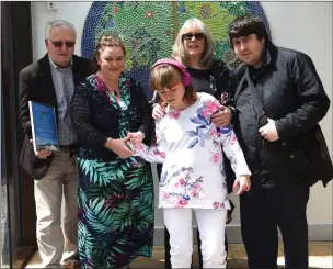  ?? Photo by Michelle Cooper Galvin ?? Georgia Harrington at her graduation withher parents David and Jo, brother Gareth and teacher Caitriona Healy at St Francis’ Special School, Beaufort.