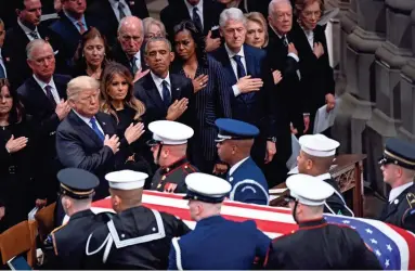  ?? JACK GRUBER/USA TODAY ?? Presidents Donald Trump, Barack Obama, Bill Clinton and Jimmy Carter pay their respects.