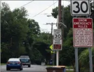  ?? TANIA BARRICKLO — DAILY FREEMAN ?? Two signs where Lucas Avenue crosses from the town of Ulster into the city of Kingston show the city’s 30 mph speed limit on Tuesday.