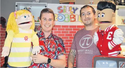  ?? DAVE STEWART/THE GUARDIAN ?? Robbie Doherty, left, and Jesse Wachter, are seen on the set of Silly Robbie’s World with two of the characters in the show, Lucky and Eddie, respective­ly. Silly Robbie’s World airs each Saturday on Eastlink Community TV.