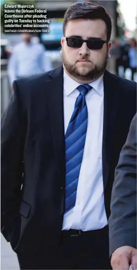  ?? SANTIAGO COVARRUBIA­S/ SUN- TIMES ?? Edward Majerczyk leaves the Dirksen Federal Courthouse after pleading guilty on Tuesday to hacking celebritie­s’ online accounts.