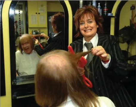  ??  ?? Blast from the past....Geraldine Kelly of Geraldine’s Hair Salon at Sunday’s Gate enjoying preparing Frank Godfrey for a sponsored charity head shave