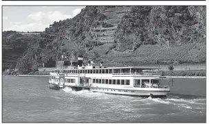  ?? Rick Steves’ Europe/RICK STEVES ?? The Rhine River is best experience­d while relaxing on the deck of a steamer, surrounded by the wonders of this romantic and historic gorge.