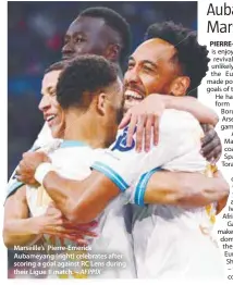  ?? – AFPPIX ?? Marseille’s Pierre-Emerick Aubameyang (right) celebrates after scoring a goal against RC Lens during their Ligue 1 match.