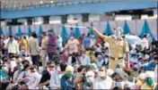  ?? TRIPATHY/HT PHOTO ?? Migrant workers wait for a Shramik Special train at Bandra ■
Terminus in Mumbai on Wednesday. sATYABRATA