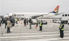  ??  ?? NOW. Passengers disembark from the inaugural commercial flight from Johannesbu­rg.