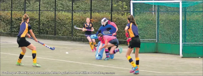  ?? 01_B43hockey0­2 ?? Goalkeeper Ali McKie and a teammate defend against another Hillhead attack.