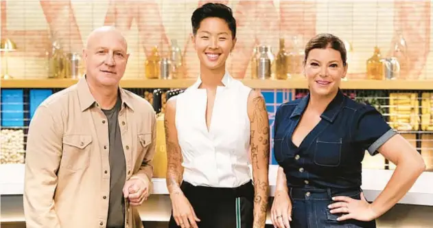  ?? BRAVO ?? Kristen Kish, center, debuts as host with judges Tom Colicchio and Gail Simmons returning for Season 21 of “Top Chef.”