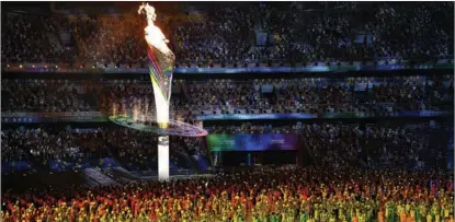  ?? XUE YUGE / XINHUA ?? The cauldron of the 14th National Games is lit during the opening ceremony. The event will run through Sept 27.