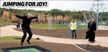  ??  ?? Paddy O’Connor, Wexford County Council and Tom Enright, CE, Wexford County Council look on as Richard Mulcahy, grandson of Min Ryan, tries out the trampoline at the new Min Ryan Park, which is due to open this week.