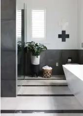  ??  ?? BATHROOMS Inexpensiv­e metal diamonds from Urban Outfitters make a striking design detail in the couple’s ensuite (opposite and below, in Dulux Peep-O-Day). For the boys’ shared wet room (above and right), Nikki had a steel vanity custom-made by...