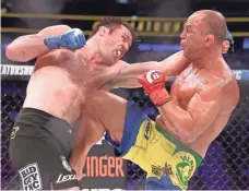  ?? ED MULHOLLAND/USA TODAY ?? Chael Sonnen, left, fighting Wanderlei Silva, is one of eight vying for the Bellator Grand Prix title.