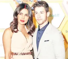  ??  ?? Actress Priyanka Chopra with her husband US musician Nick Jonas pose during Bumble’s launch party in New Delhi. — AFP photo