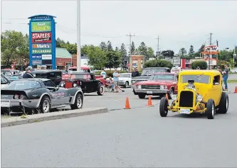  ?? CATHERINE WHITNALL/METROLAND ?? After many years of gathering out in front of the A&amp;W and Mark's, the Lindsay A&amp;W Cruisers are now setting up in the north end of the Canadian Tire parking lot, along Kent Street.