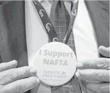  ?? Luke Sharrett / Bloomberg file ?? A NAFTA supporter was at the annual American Farm Bureau Federation conference in Nashville, Tenn., early this year.