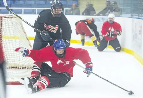  ?? JULIE JOCSAK/POSTMEDIA NEWS ?? Nick Brake of the Thorold Blackhawks tries to keep the puck ahead of a Brampton Bombers player during the Canucks Junior Classic at the Gale Centre in Niagara Falls on the weekend.