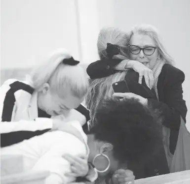  ?? MARK MAKELA / POOL PHOTO VIA AP ?? Accuser Lili Bernard, foreground, is consoled by grief counsellor Caroline Heldman, left, as accuser Victoria Valentino, right, is comforted outside the courtroom after Bill Cosby was found guilty in his sexual assault retrial on Thursday at the...