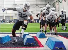  ?? SARAH GORDON/THE DAY ?? UConn redshirt junior Eli Thomas works though a drill during the first day of football practice Wednesday in Storrs.