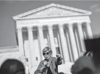  ?? Kent Nishimura/Los Angeles Times ?? Sen. Elizabeth Warren, D-Mass., speaks to abortion rights activists outside the U.S. Supreme Court. “I am angry but committed,” she told them.