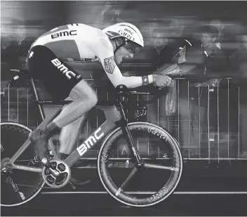  ?? PHOTOS: GETTY IMAGES/FILES ?? Switzerlan­d’s Stefan Kung competes July 1 in a 14-kilometre individual time trial during the first stage of the 104th edition of the Tour de France. Riders at the front of the pack during the time trial stages of the race have powerful bodies built for speed.