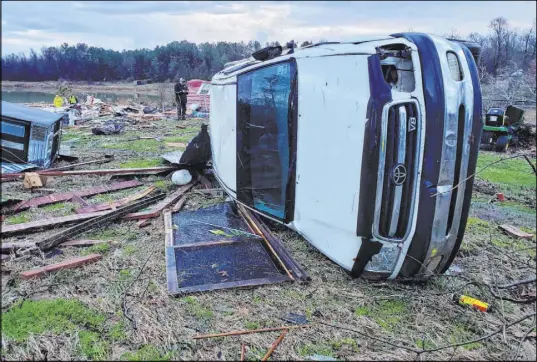  ?? Bossier Parish Sheriff ’s Office ?? Damage from Friday night’s severe weather, including an elderly couple’s home, is seen in Bossier Parish, La., on Saturday. The Bossier Parish Sheriff ’s Office said the couple’s bodies were found Saturday near their demolished trailer by firefighte­rs.