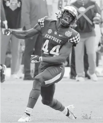  ?? SAM GREENWOOD/GETTY ?? Kentucky’s Jamin Davis celebrates a defensive stop against North Carolina State during the TaxSlayer Gator Bowl on Saturday at TIAA Bank Field in Jacksonvil­le, Fla.