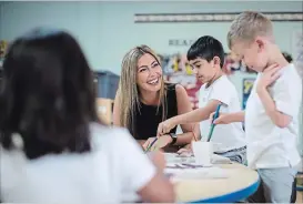  ?? DARRYL DYCK THE CANADIAN PRESS ?? Natacha Beim, CEO and founder of CEFA (Core Education and Fine Arts) Early Learning, jokes with kids at a CEFA daycare franchise, in Langley, B.C..
