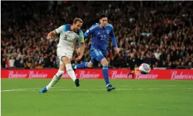  ?? ?? Harry Kane powers past Alessandro Bastoni to make it 3-1 and ensure England reach Euro 2024. Photograph: Tom Jenkins/The Guardian