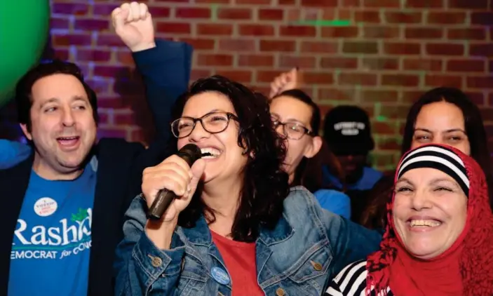  ?? Photograph: Rebecca Cook/Reuters ?? Michigan congressio­nal candidate Rashida Tlabi celebrates becoming, along with Minnesota’s Ilhan Omar, the first Muslim women in Congress.