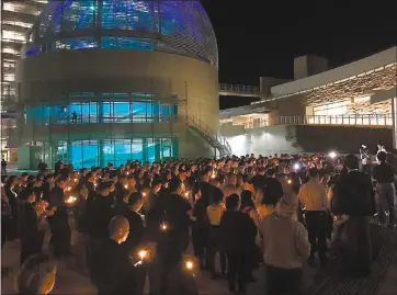  ?? PHOTOS BY JASON GREEN —STAFF ?? Hundreds gathered on Friday at San Jose City Hall to pay tribute to Michelle Vo, who was killed Oct. 1 when Stephen Paddock opened fire on the Route 91 Harvest Festival in Las Vegas from his room on the 32nd floor of the Mandalay Bay Resort and Casino.