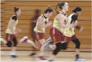  ?? STAFF PHOTO BY NANCY LANE ?? COURTING SUCCESS: BC players hit the court running during a recent practice.