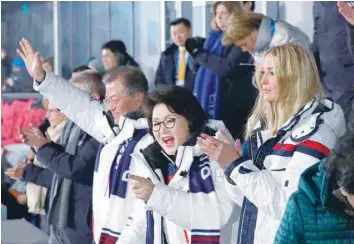  ?? — AFP ?? US President ‘s daughter and senior White House adviser Ivanka Trump, South Korean first lady Kim Jung-sook and South Korean President Moon Jae-in applaud as athletes from North and South Korea walk together during the closing ceremony of the...