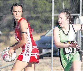  ??  ?? SEASON UNDERWAY: Taylors Lake defender Tia-ana Parker looks to pass as Jeparit-rainbow shooter Maddie Marra makes a move to defend down the court. The Storm won by 16 goals. Picture: WILLAMY IMAGES