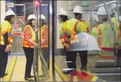  ?? Christina House Los Angeles Times ?? COUNTY SUPERVISOR Hilda Solis boards a train during a preview of Metro’s Regional Connector.