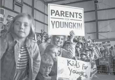  ?? CARLOS BERNATE/THE NEW YORK TIMES ?? People attend a campaign event for Glenn Youngkin on Monday in Chesterfie­ld, Virginia.